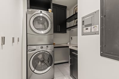 Washer and dryer are conveniently located and tucked away near sleeping quarters. PEA-1114