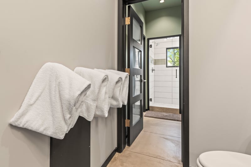 Access hallway provides additional privacy for this well-appointed bath.