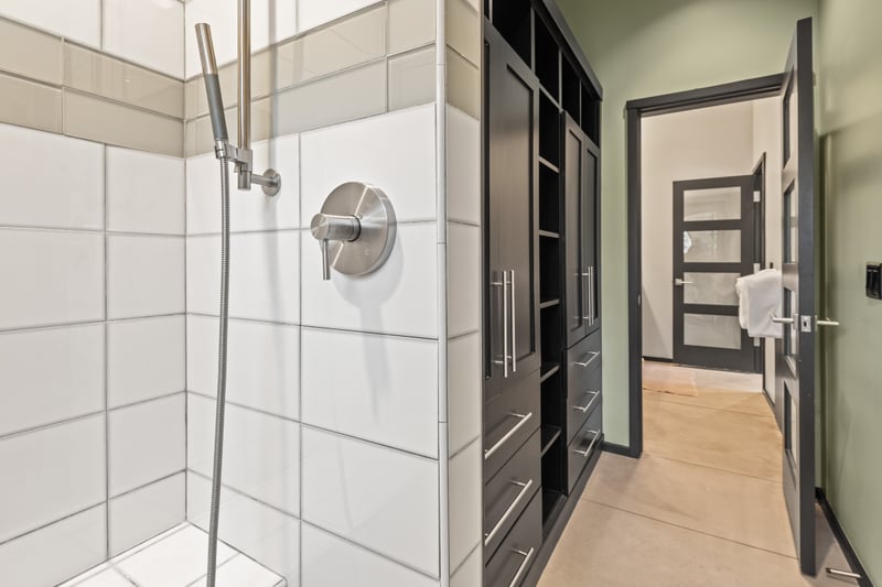 Walk-in shower detail highlights quality finishes and thoughtful design.
