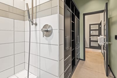 Walk-in shower detail highlights quality finishes and thoughtful design.