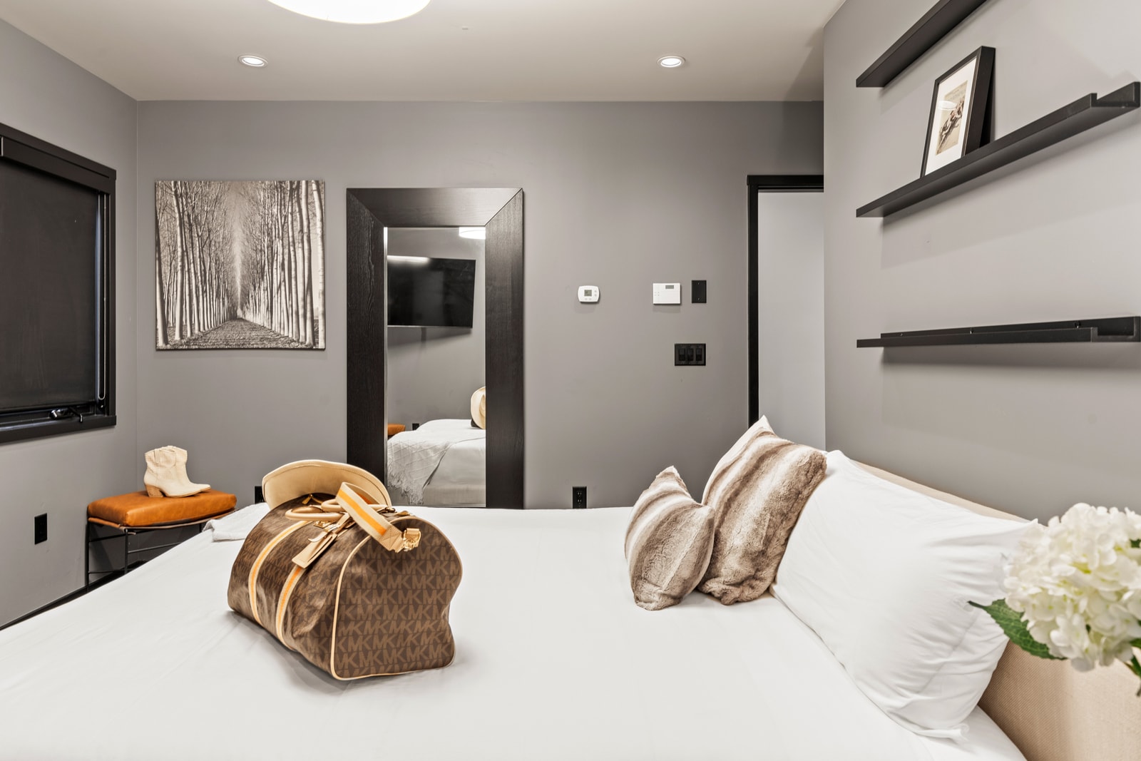 View from the opposite angle shows additional furnishings and spacious layout.