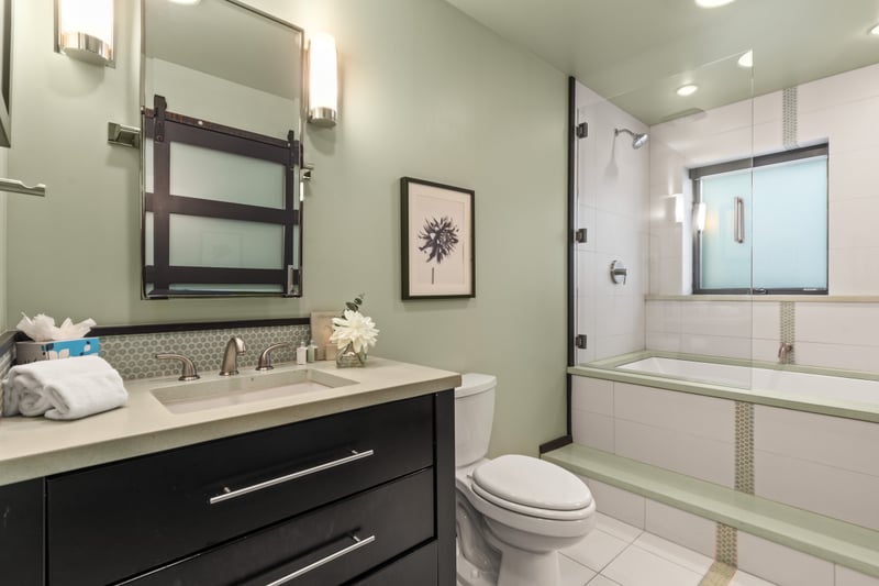 Granite dual vanity, elegant lighting, and a full tub/shower combo complete your ensuite. PEA-1114