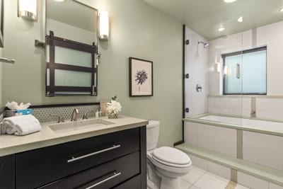 Granite dual vanity, elegant lighting, and a full tub/shower combo complete your ensuite. PEA-1114