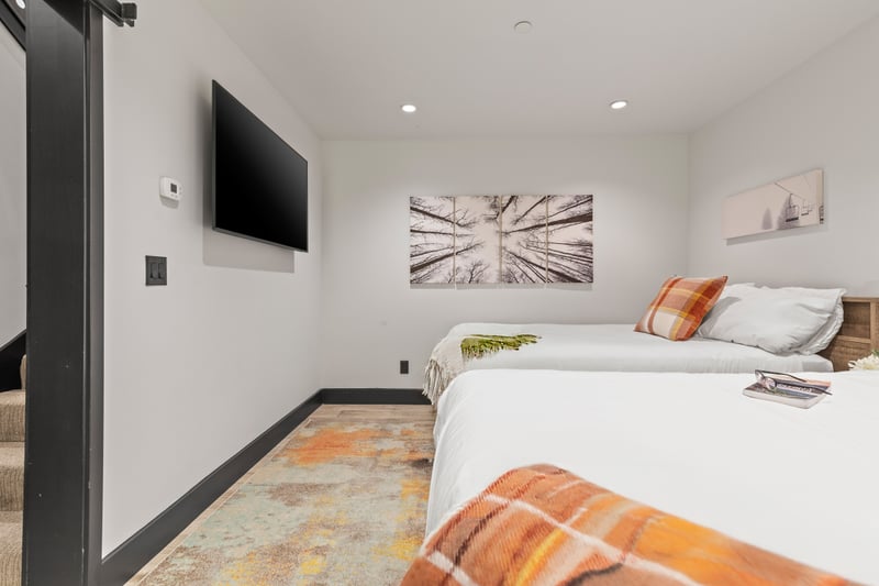 Cozy yet bright, this lower-level room offers two Full beds and modern comforts.