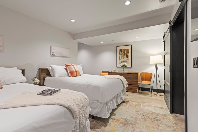 Bedroom four includes two Full beds, cozy bedding, and plenty of space for friends or kids.