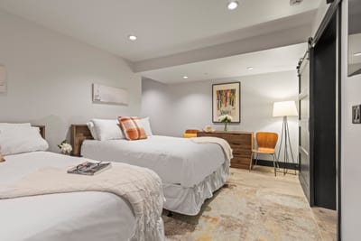 Bedroom four includes two Full beds, cozy bedding, and plenty of space for friends or kids.