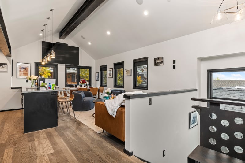 Wide-angle view of the living and kitchen area highlights spacious layout and natural light. PEA-1114