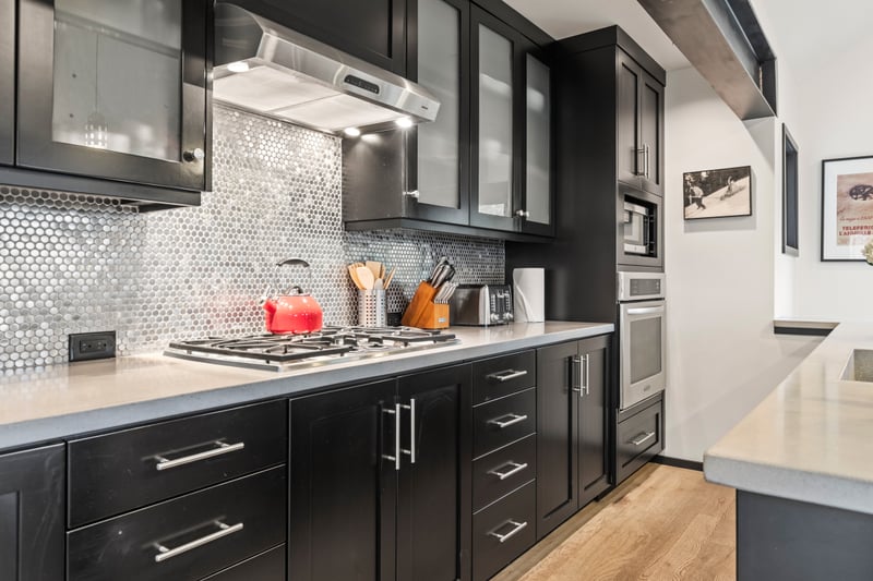 Full-length cabinetry, tile backsplash, and streamlined design offer both beauty and utility. PEA-1114