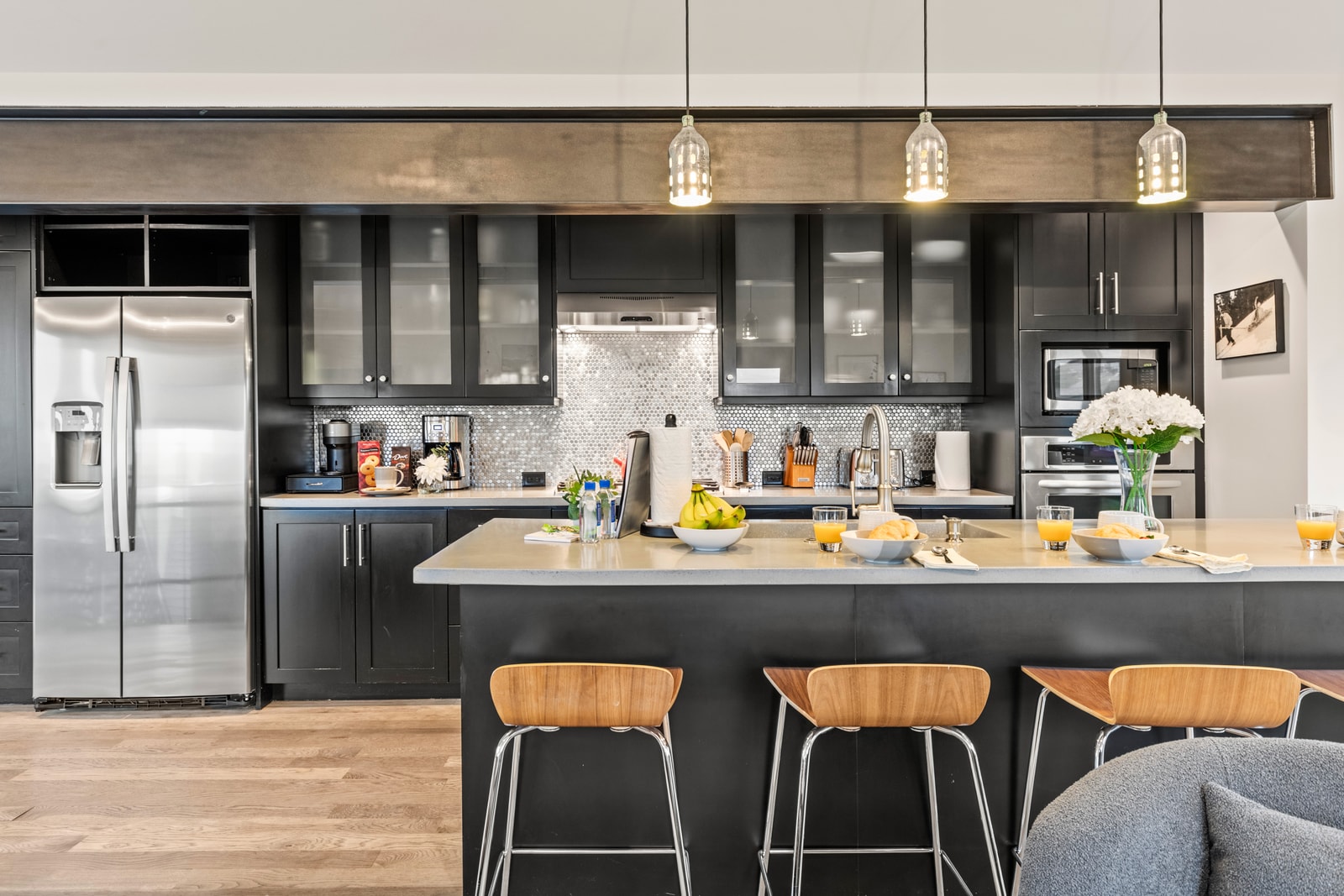 Your gourmet kitchen includes a gas range, large fridge, and plenty of counter space for prep and gathering.