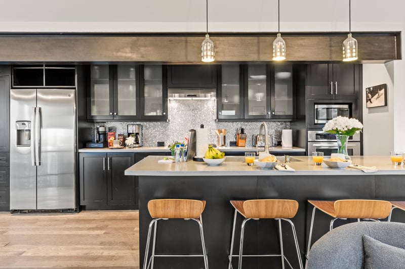 Your gourmet kitchen includes a gas range, large fridge, and plenty of counter space for prep and gathering. PEA-1114