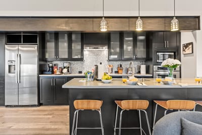 Your gourmet kitchen includes a gas range, large fridge, and plenty of counter space for prep and gathering. PEA-1114
