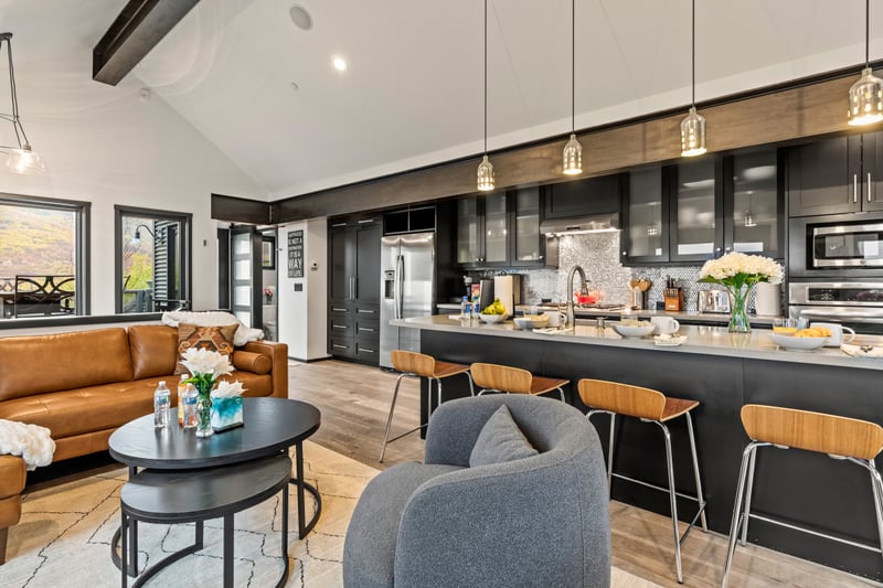 Oversized island with bar seating makes breakfast, snacks, and happy hour effortless. PEA-1114