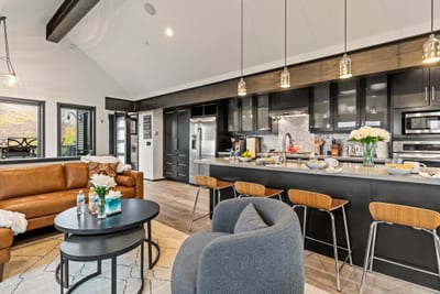 Oversized island with bar seating makes breakfast, snacks, and happy hour effortless. PEA-1114
