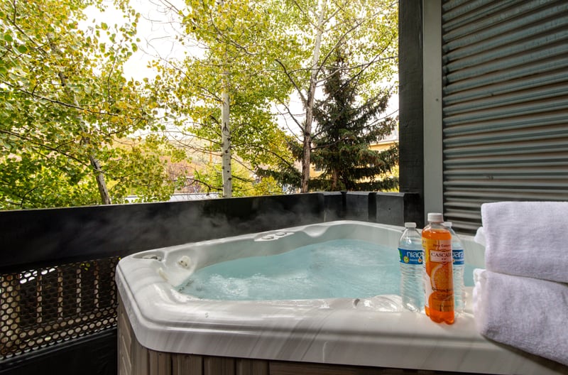Relax among the trees in your private hot tub just steps from the bedroom door. PEA-1114