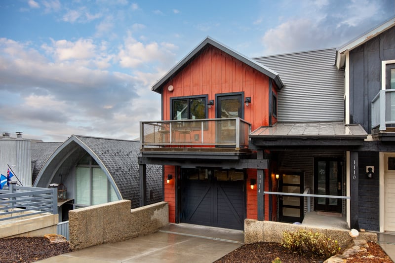 Modern mountain exterior with private garage welcomes you to your multi-level retreat. PEA-1114