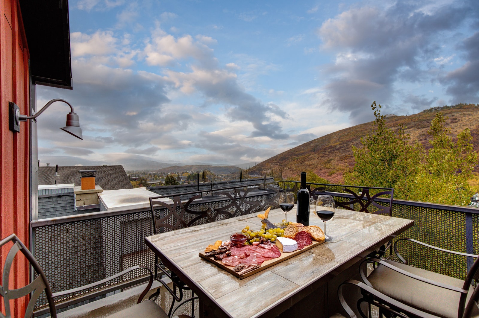 Enjoy sunset drinks and charcuterie on your private balcony with peaceful hillside views.