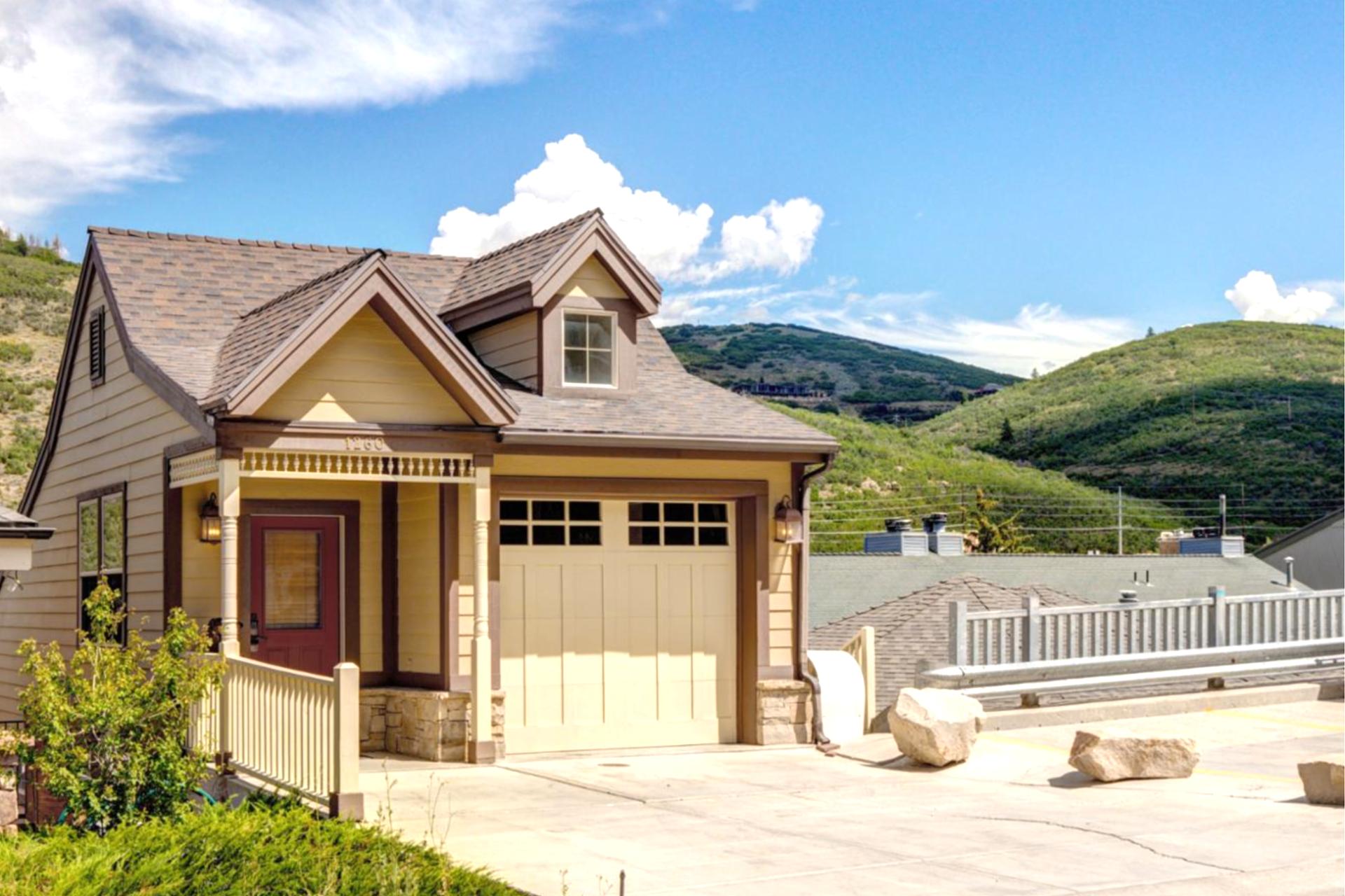 A charming single-family home with mountain views and a private driveway.