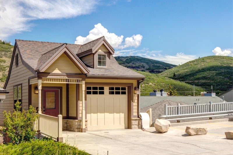 A charming single-family home with mountain views and a private driveway.