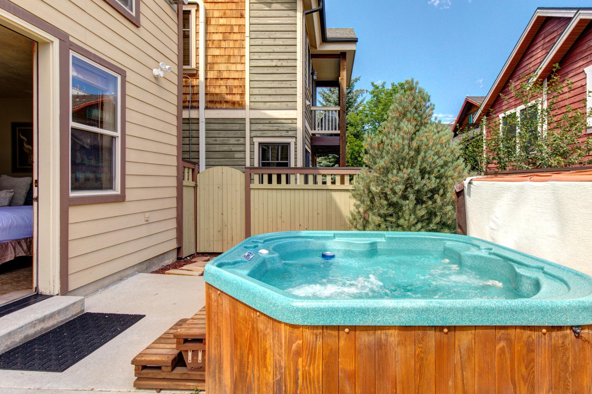 A second look at your private outdoor hot tub, set against the mountain backdrop for a true alpine soak.