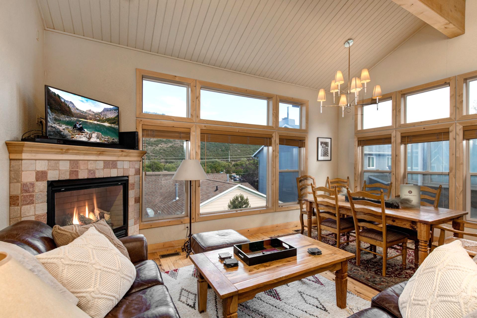 An alternate view of the dining area with elegant lighting and plenty of space for shared meals or board games.