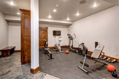 Stay on track in the home gym with free weights, yoga mats, and cardio machines.