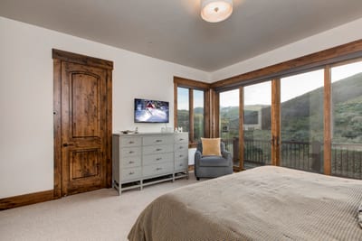 Another look at Guest Bedroom 4 with cozy bedding and natural light.