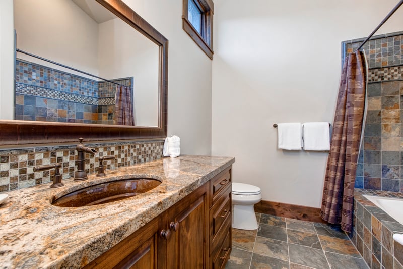 Shower and tub with granite countertop
