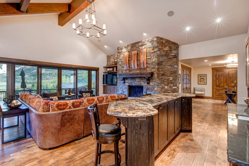 Open area with kitchen, living room, and bar
