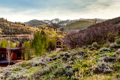 Deck overlooks rolling hills and treetops for a peaceful start to the day.