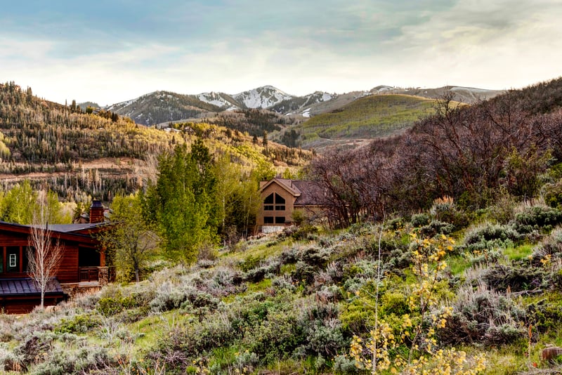 Deck overlooks rolling hills and treetops for a peaceful start to the day.
