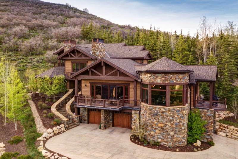 Stunning timber and stone mountain home located in the prestigious Solamere, surrounded by lush trees.
