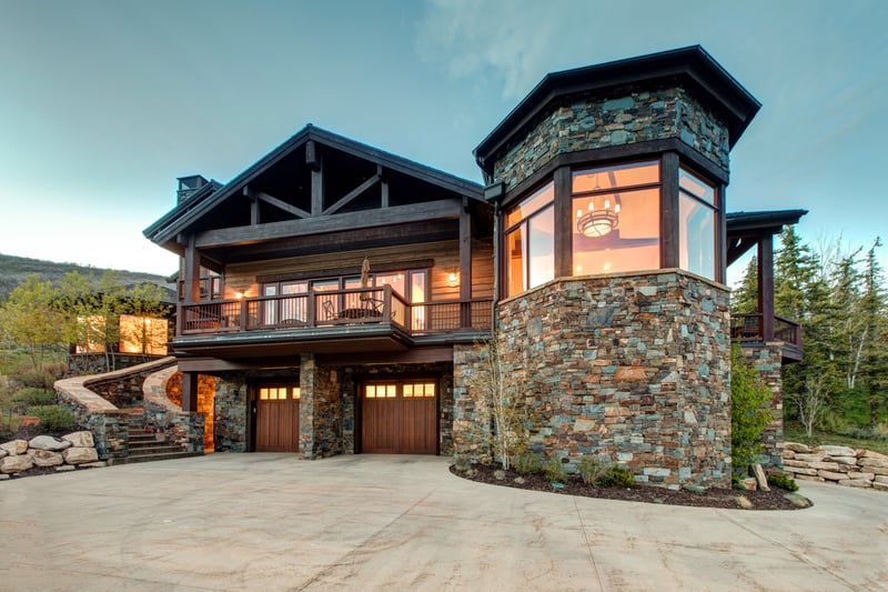 Timber-framed design and stone accents give this home its distinct alpine character.