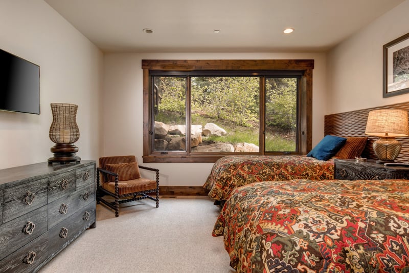 Another angle of this beautiful room reveals the elegant bedframe and the tranquil views beyond.