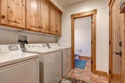 Laundry setup ensures easy clean-up after days on the slopes.
