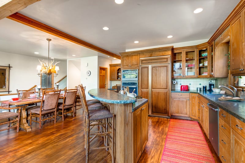 Kitchen layout supports large group meals and easy flow into the dining area.