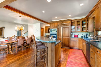 Kitchen layout supports large group meals and easy flow into the dining area.