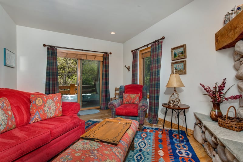 Second family room includes seating, TV and access to outside hot tub