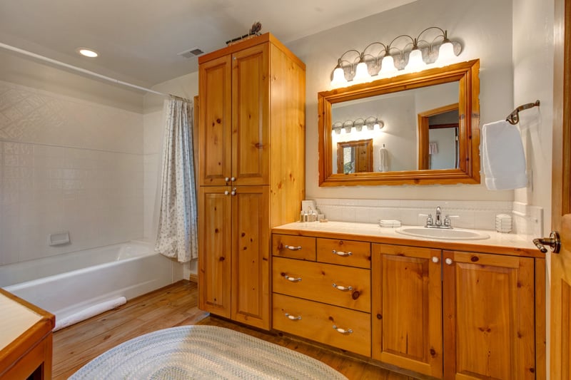 Guest Bathroom includes granite vanity, full tub/shower combo, and thoughtful touches.