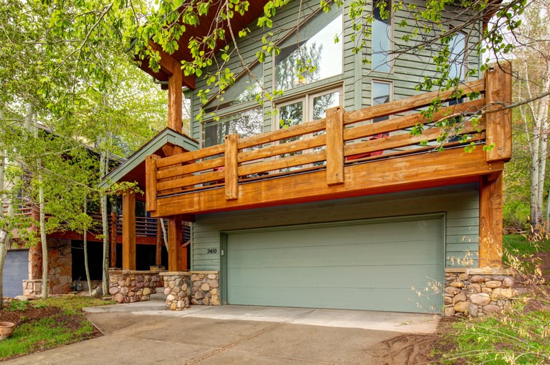 Parking area includes covered and driveway space for multiple cars.