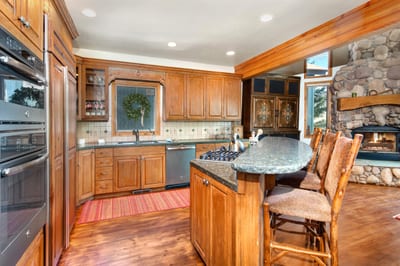 Fully equipped kitchen with double ovens, gas range, and plenty of prep space for group meals.