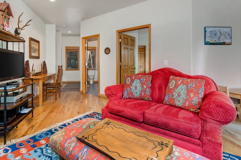 Additional family room angle showing bright, open space and cozy layout.