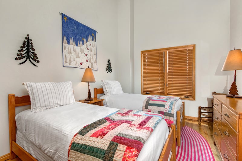 Guest Bedroom features a Twin bed with vintage iron frame and charming finishes.