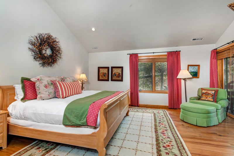 The King primary suite features a seating area, walk-in closet, and direct access to a luxurious ensuite.