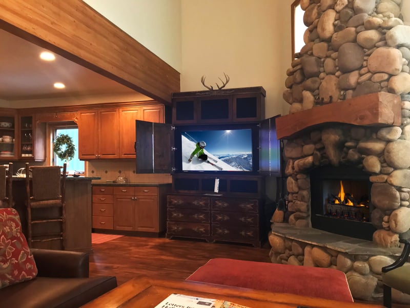 Cozy up by the river rock fireplace and catch a movie on the flatscreen TV after a day outdoors.