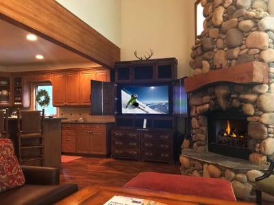 Cozy up by the river rock fireplace and catch a movie on the flatscreen TV after a day outdoors.