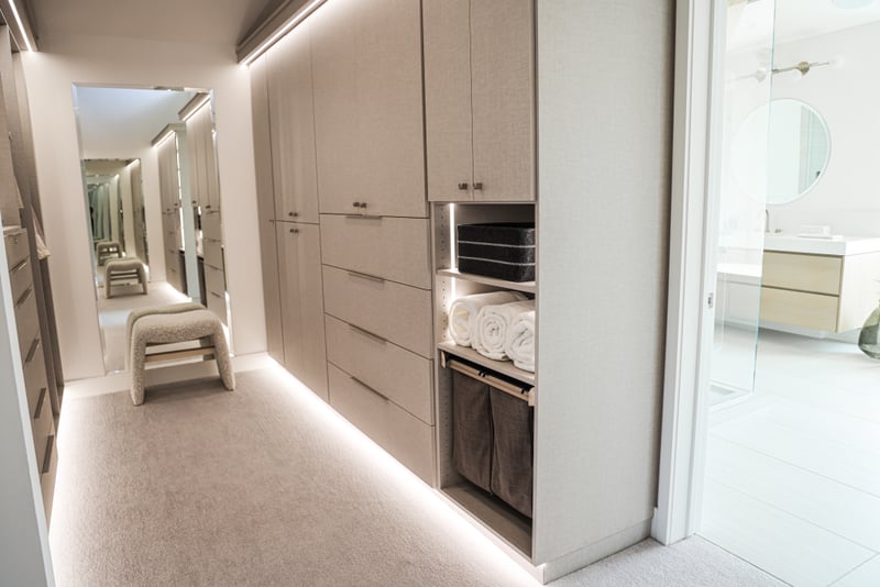 A second view shows the walk-through closet with custom lighting and cabinetry.