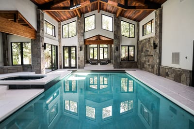 Swim year-round in your private indoor pool with vaulted ceilings and retractable doors to the patio.