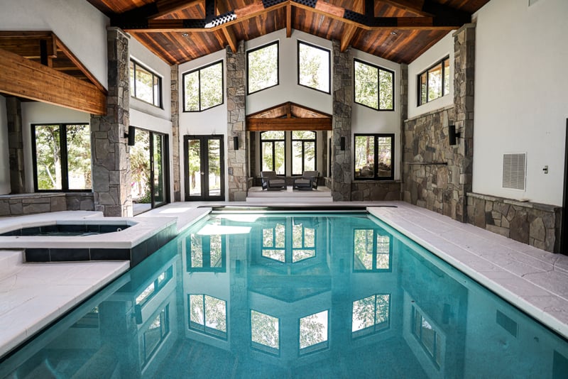 Swim year-round in your private indoor pool with vaulted ceilings and retractable doors to the patio.