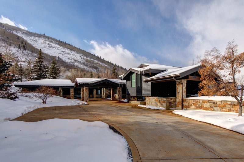 A sweeping drive leads to your private mountain retreat with grand entrance and multiple garages.