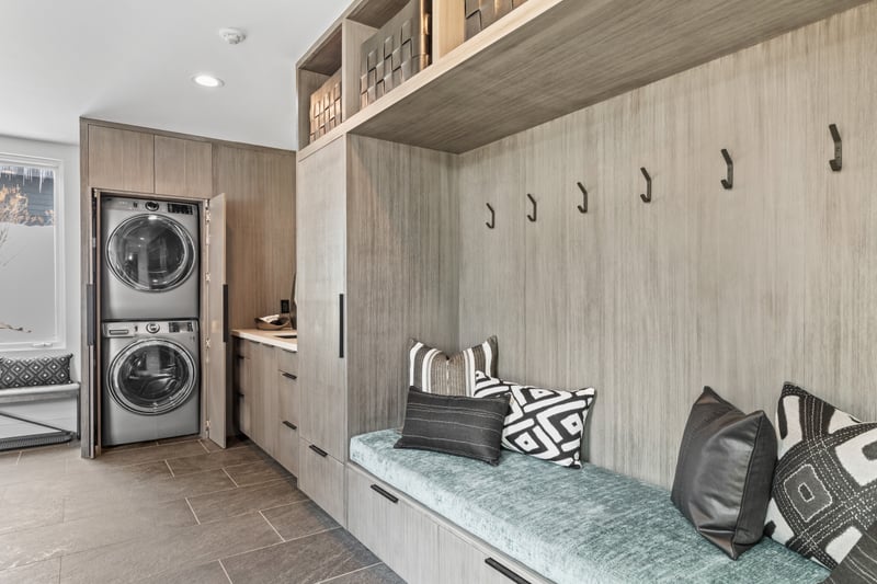 Drop your gear in the custom mudroom with hooks, cubbies, and stackable washer/dryer.